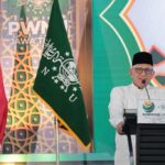 KH. Abdul Hakim Mahfudz saat menyampaikan sambutan di Konferwil PWNU Jawa Timur di Pesantren Tebuireng, Jumat (02/08/2024). Foto: tebuireng.online